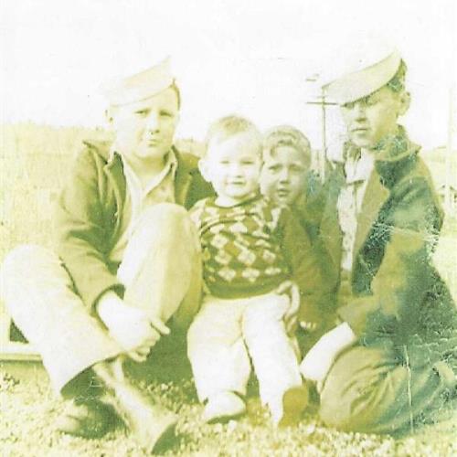 Bill Roney, Larry Roney and Jim Roney (Unknown person in argyle sweater vest)