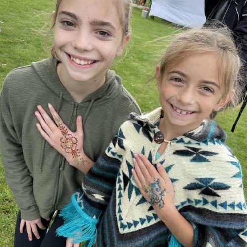 Hand painting at a festival with cousin Molly