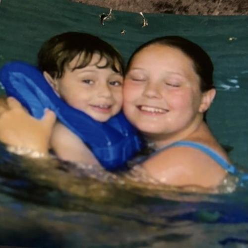 Christine showing love to her baby brother