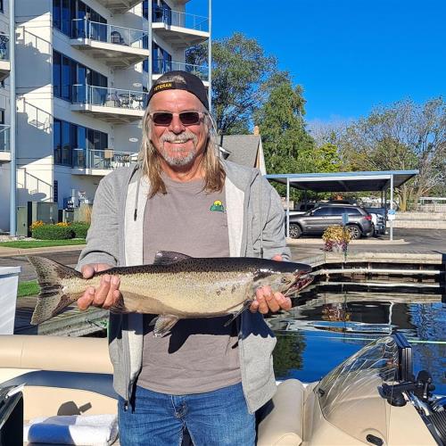 Rick with the salmon he caught in Muskegon lake