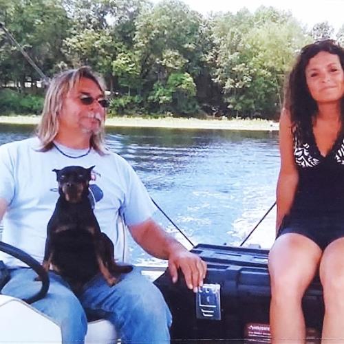 Rick with his dog Ranger and Wife Lori enjoying o e of many boat rides at GLC