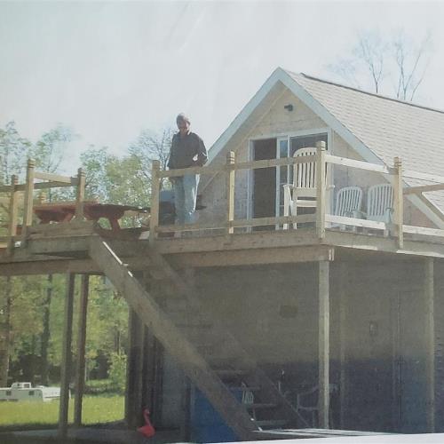 Rick on the deck of the 1st home atop the shower house
