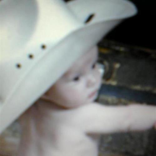 Jace with great-granpda's cowboy hat