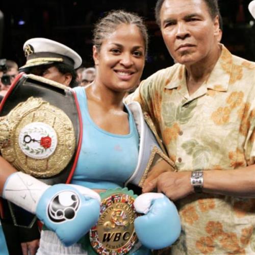 Laila Ali, left, poses with her father, boxing great Muhammad Ali, after her win against Erin Toughill at the MCI Center in Washington, June 11, 2005.