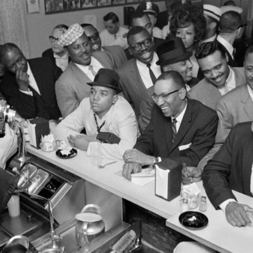 Malcolm X photographs Muhammad Ali after he became World Heavyweight Champion in 1964.
