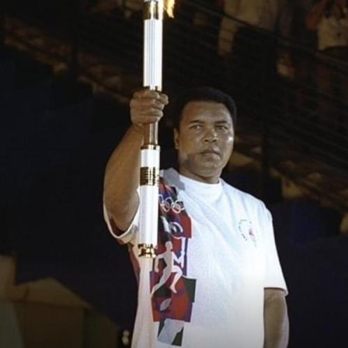 In an opening ceremony surprise, with undisguised challenges holding the torch and yet focused and precise, Ali lights the Olympic cauldron in a moment that captivates 3.5 billion worldwide viewers.